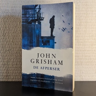 Cover van het tweedehands boek 'De afperser' door John Grisham, getoond in 400x400 pixels